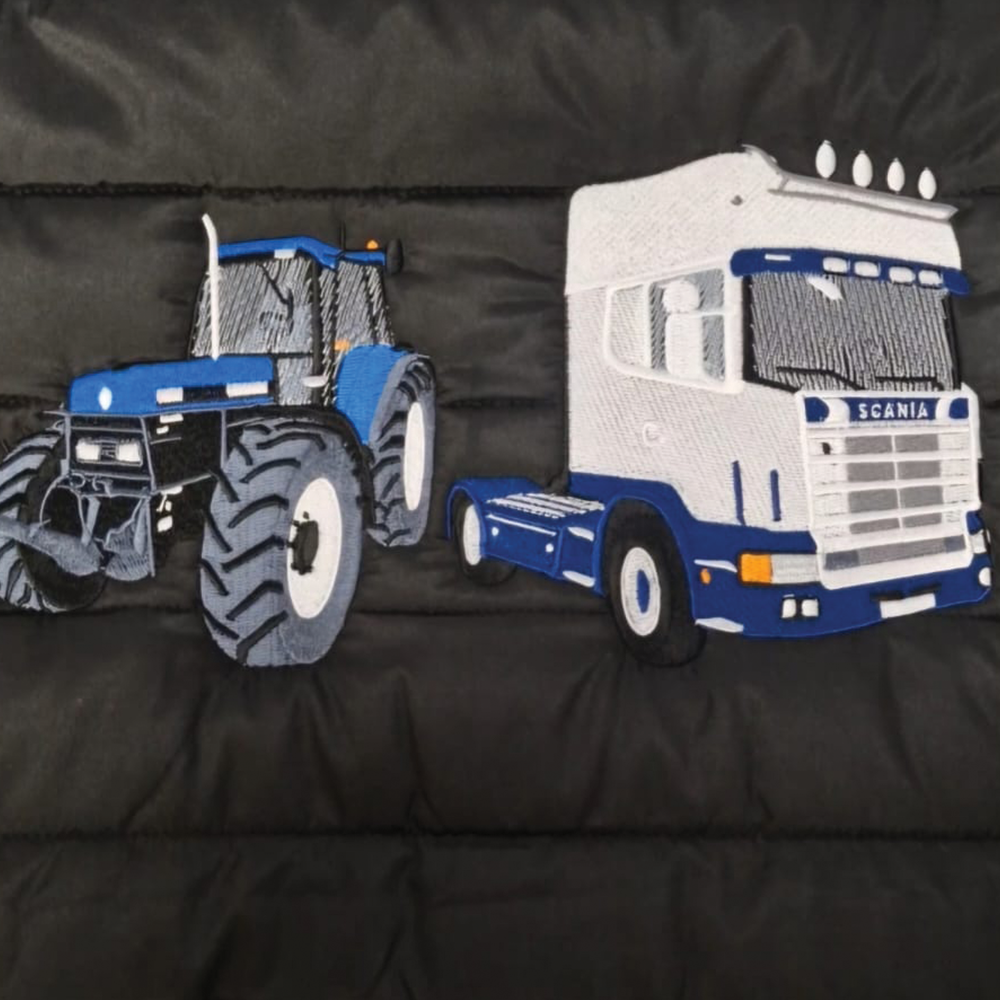 Tractor and Scania truck embroidery stitched on quilted padded jacket fabric