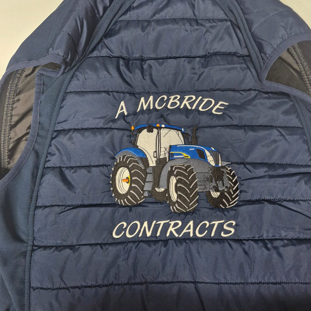 Tractor embroidery stitched on quilted puffer vest