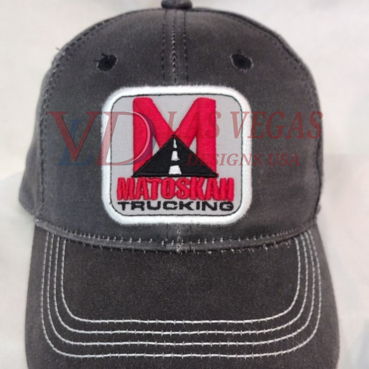 Matoski Trucking logo patch embroidery stitched on baseball caps