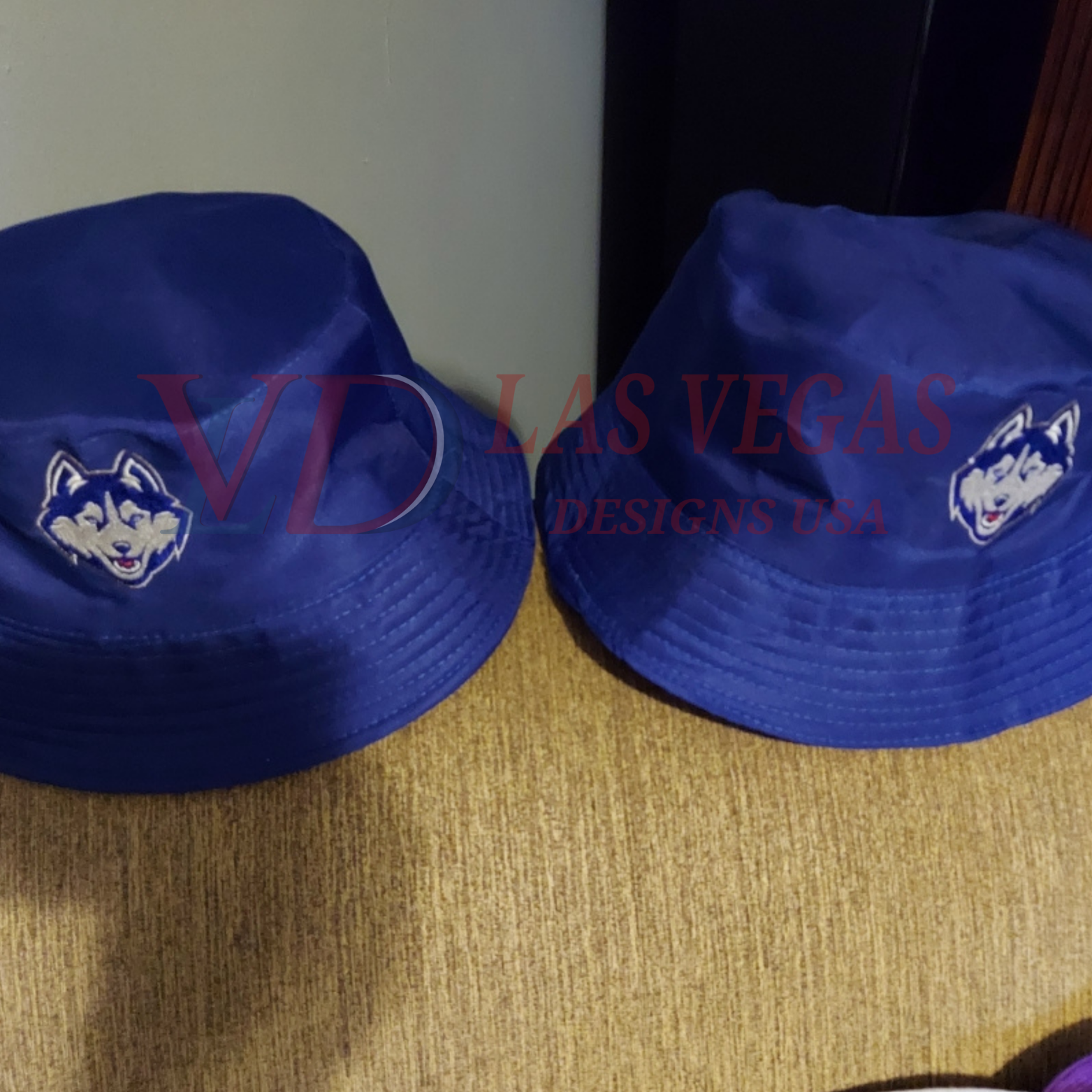 UConn Huskies logo embroidery stitched on bucket hats