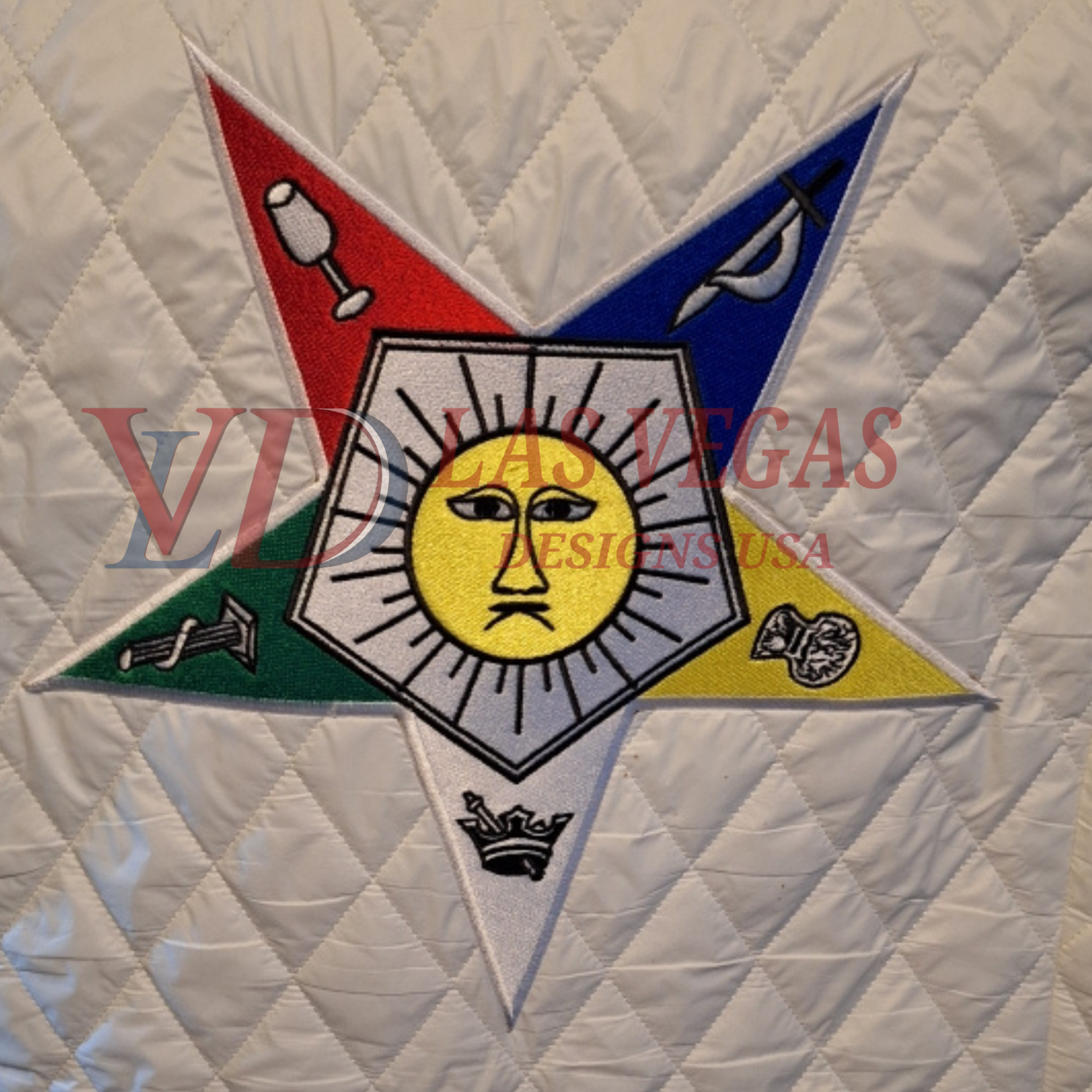 Eastern Star stitched-out emblem on quilted fabric